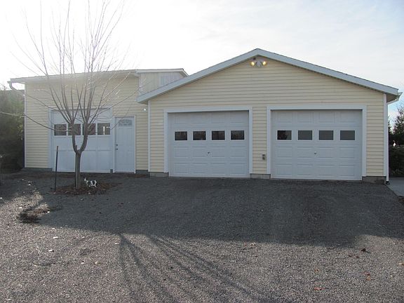 2 car heated garage + 1 car heated workshop with lift