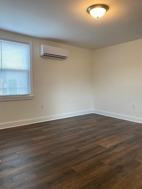 Spacious Living Room with hardwood floors.