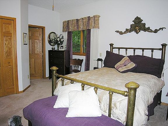 Master bedroom features dual closets and private bath