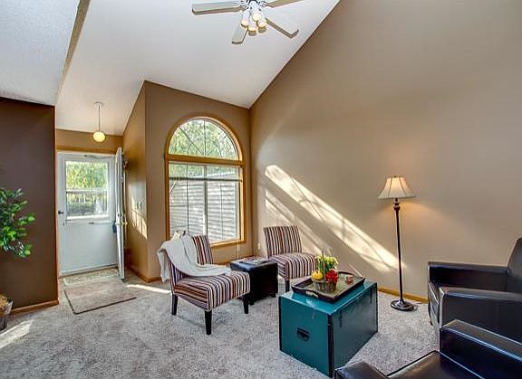 Bright, vaulted living room with a skylight!