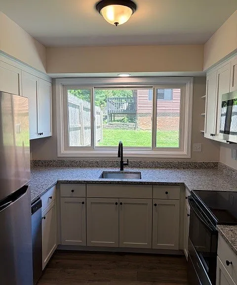 Galley Kitchen with Portrait Window to Back Yard Patio - All New Never Used Appliances
