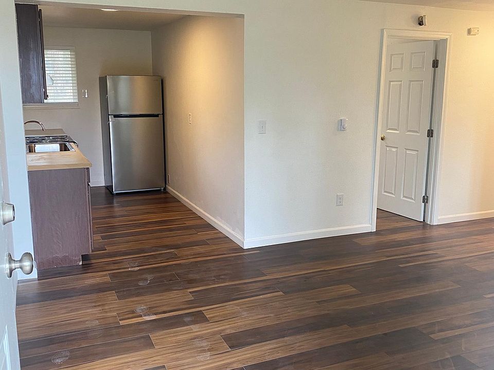 Freshly painted and new hardwood floors.