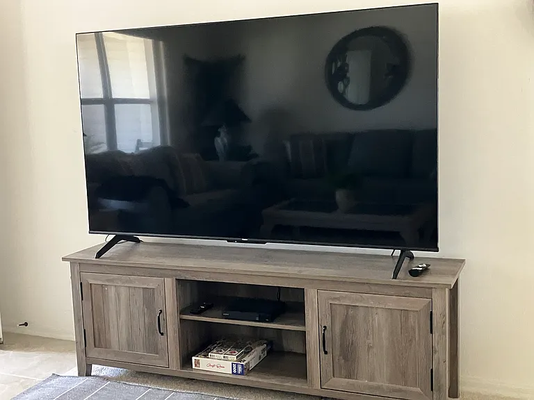 Enjoy football games and movies on the 75 inch living room tv