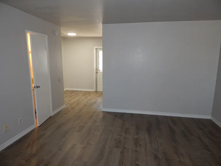 2 bed townhome, family room view to dining room and half bath