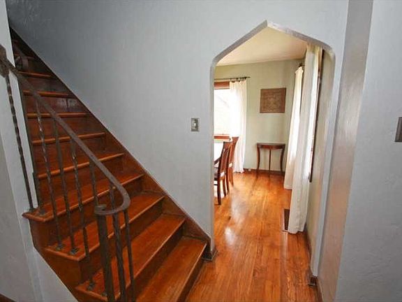 Other. The entry has so much character! Wrought iron railings, hardwood floors, and custom archways.