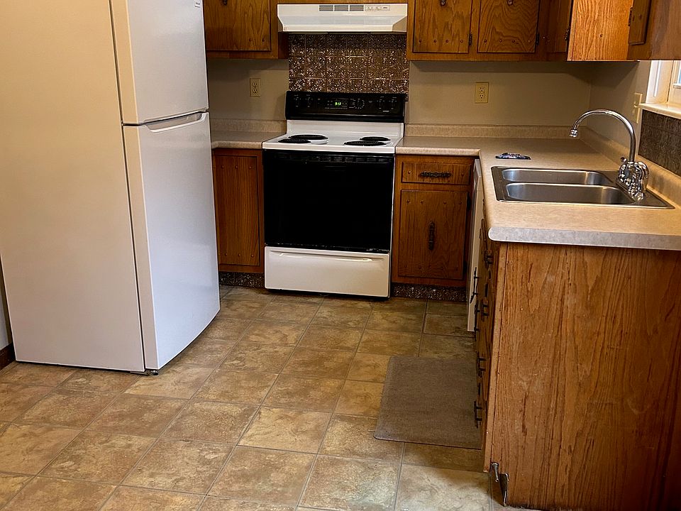 Spacious kitchen with room for a small table; range and refrigerator provided