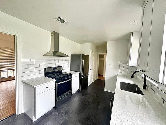 Updated Kitchen with brand new stainless steel appliances, granite counters, and backsplash.