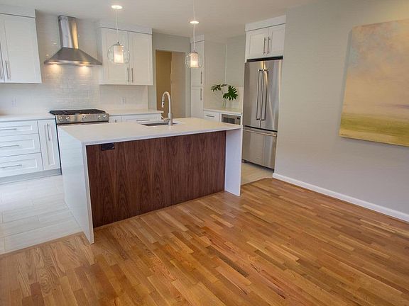 Beautiful open space. Complete high-end remodel.Kitchen is a dream. Quartz waterfall counter with Walnut back. Large pot and pan drawers, pantry and spice pool-outs for ease and convenience. All quality Stainless appliances: Gas range, Dish Washer, Double