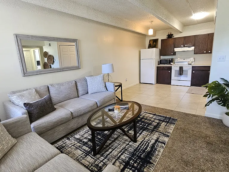 Living Room/Kitchen shown with Furniture. Furniture not included.