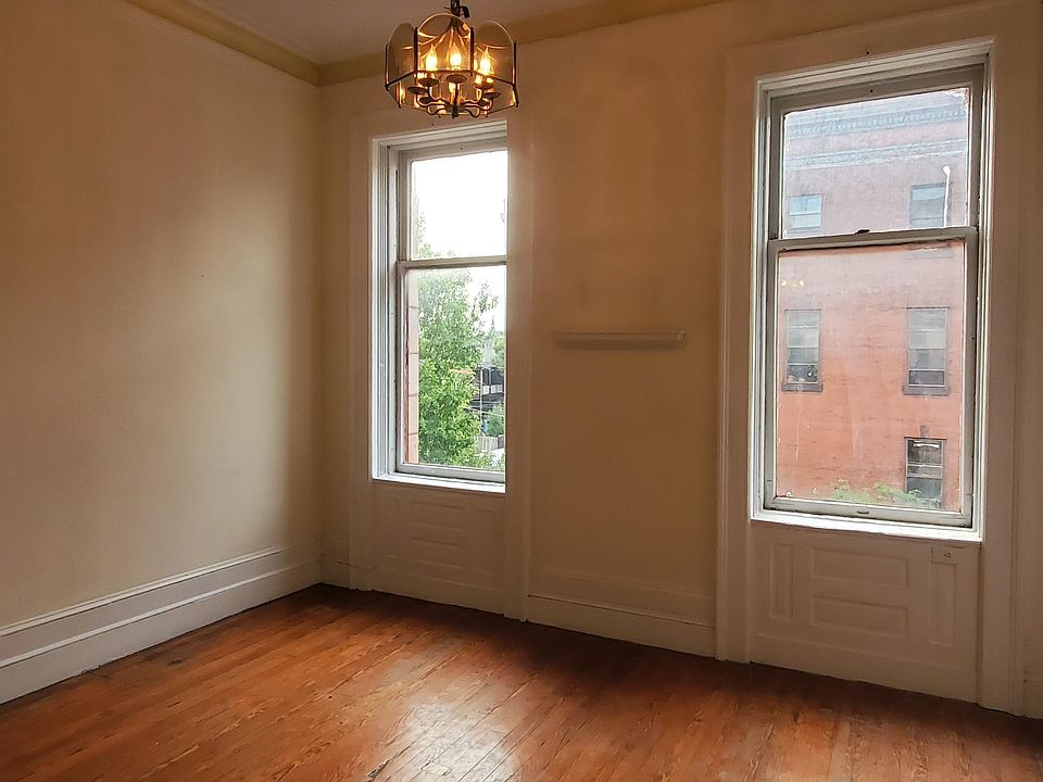 Living/Dining Roomwith tall windows.