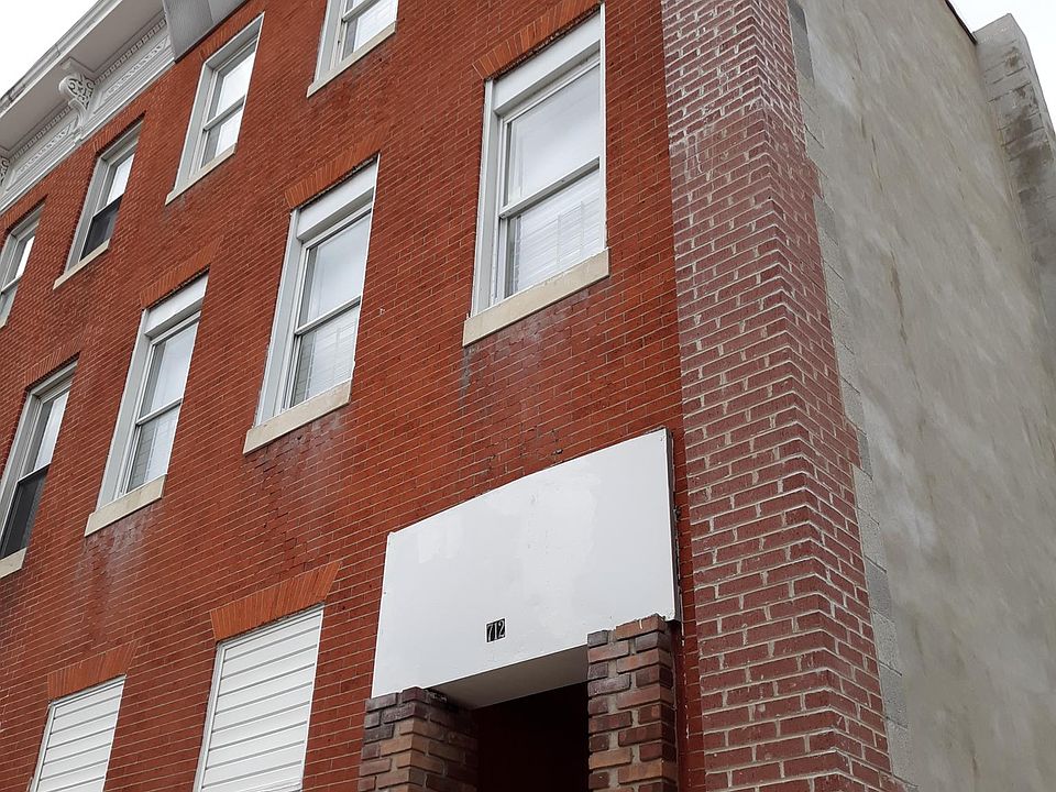 Front of the building. Double pane replacement windows. Lead free certificate