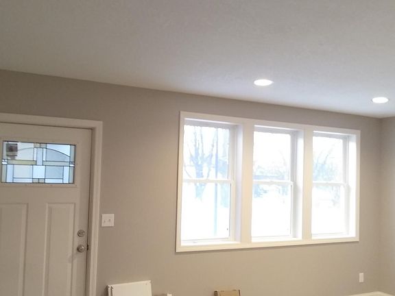 A large living room with natural light filtering through
