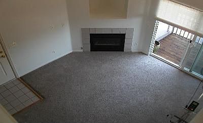 Living room w gas fireplace w space for TV above & hall closet.