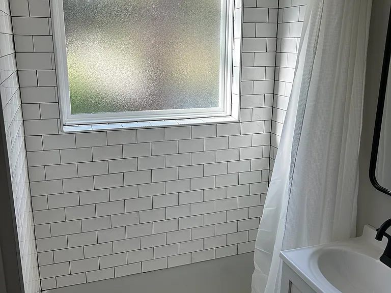 Main floor bath with bathtub and shower.