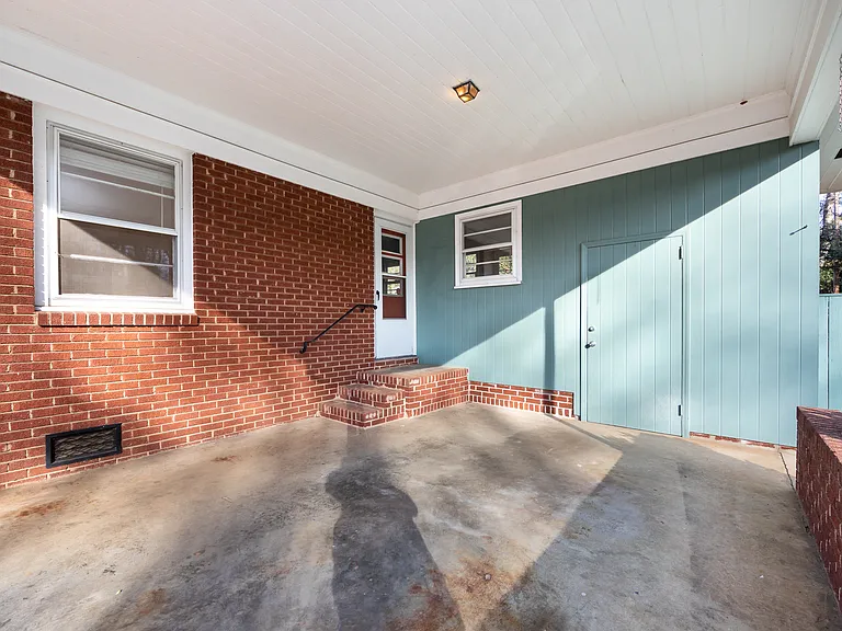 CARPORT, SIDE ENTRANCE TO HOUSE, ENTRANCE TO WORKSHOP / STORAGE AREA