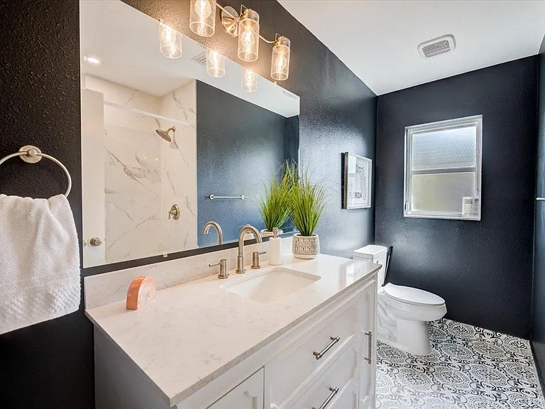 New main bathroom with shower/tub.