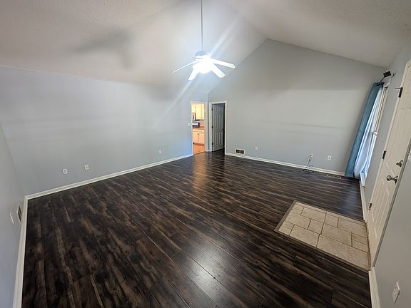 Walking in from the front door is the living room with vaulted ceiling