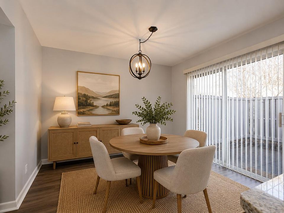 Dedicated dining space with access to the private patio, ideal for both casual meals and hosting guests. Photos are virtually staged.