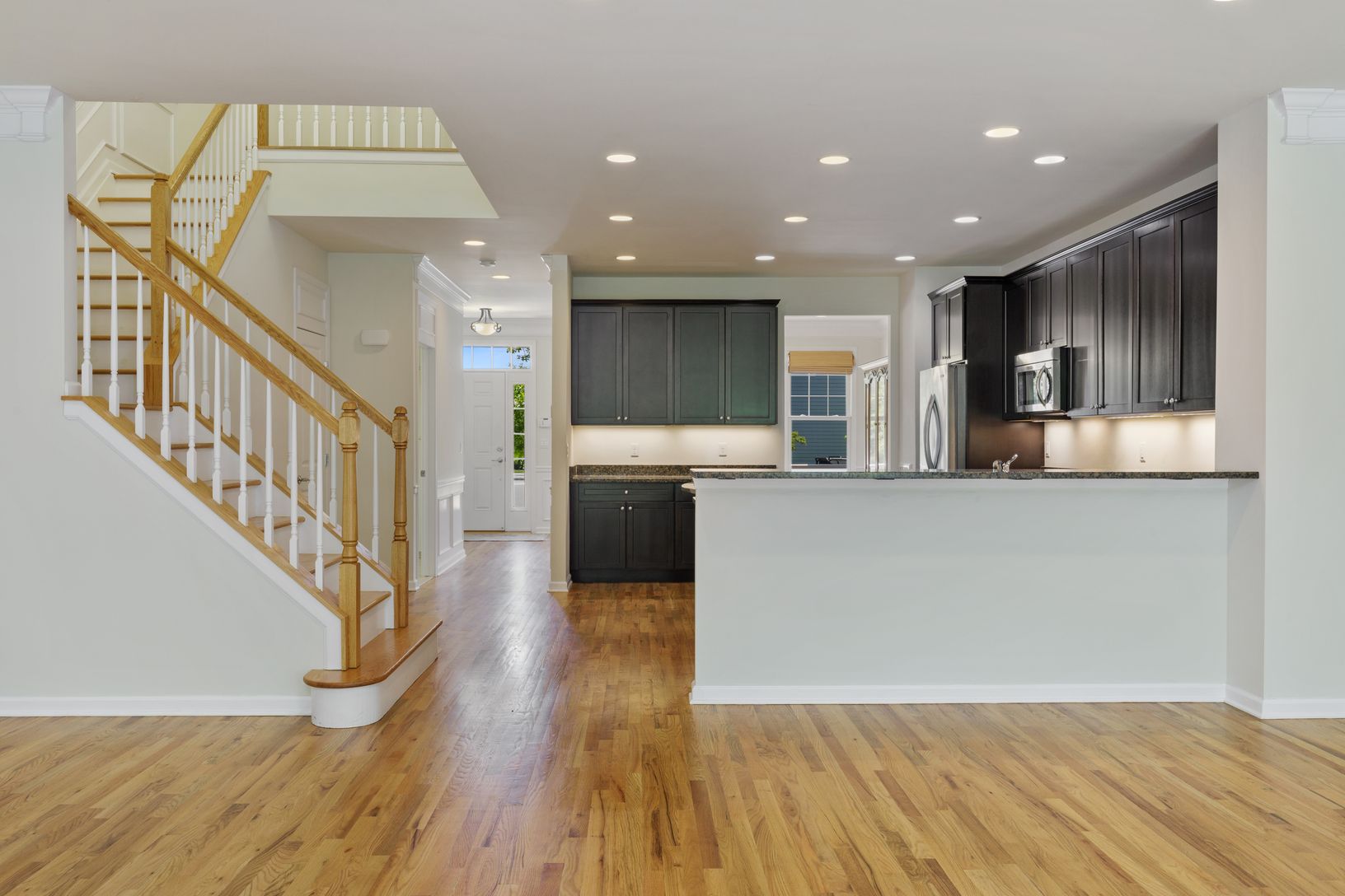  Open Layout with Hardwood Floors and Beautiful Ascending Staircase