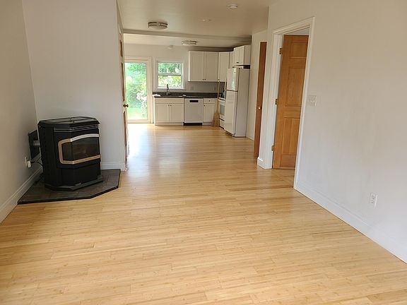 1st floor - living room, 2nd bedroom (1st door on the right), 1/2 bath with washer dryer (2nd door on right), Kitchen with sliding door out to deck, pellet stove for heat
