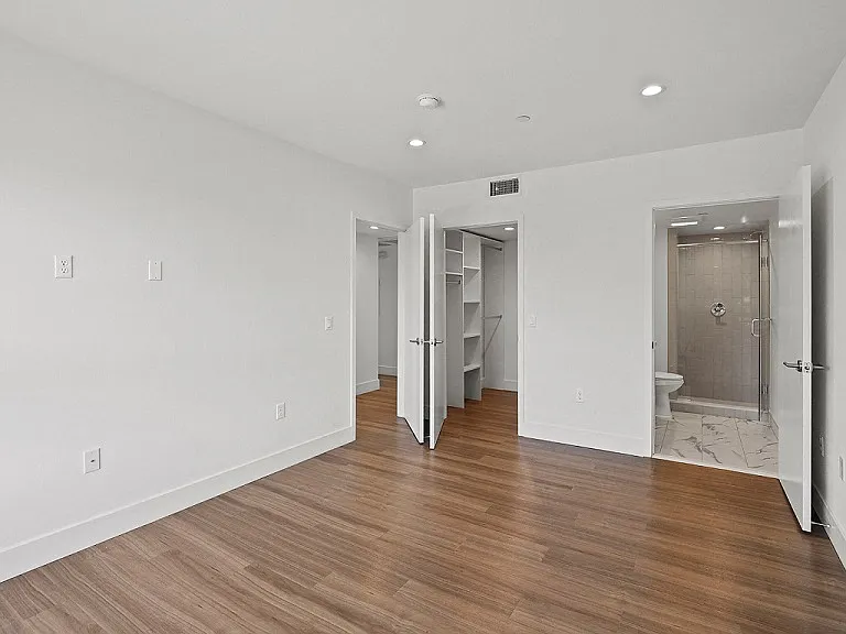 Bedroom with Bathroom and Walk-In Closet