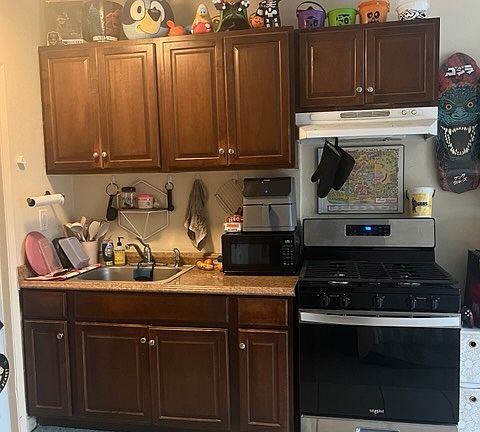 Newer Kitchen Caninets with a Brand New 5 Burner Stove/ Oven & Microwave