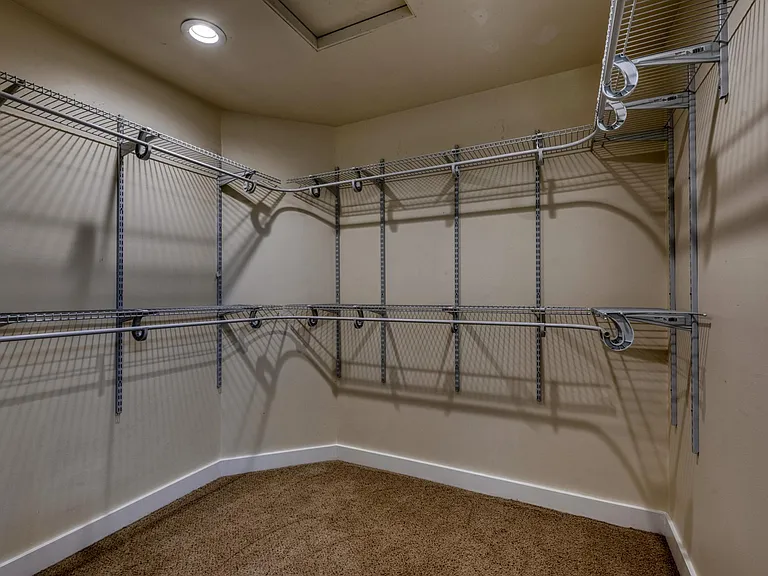 Primary Bedroom Closet with Double shelves for extra storage and room to hang all the clothes