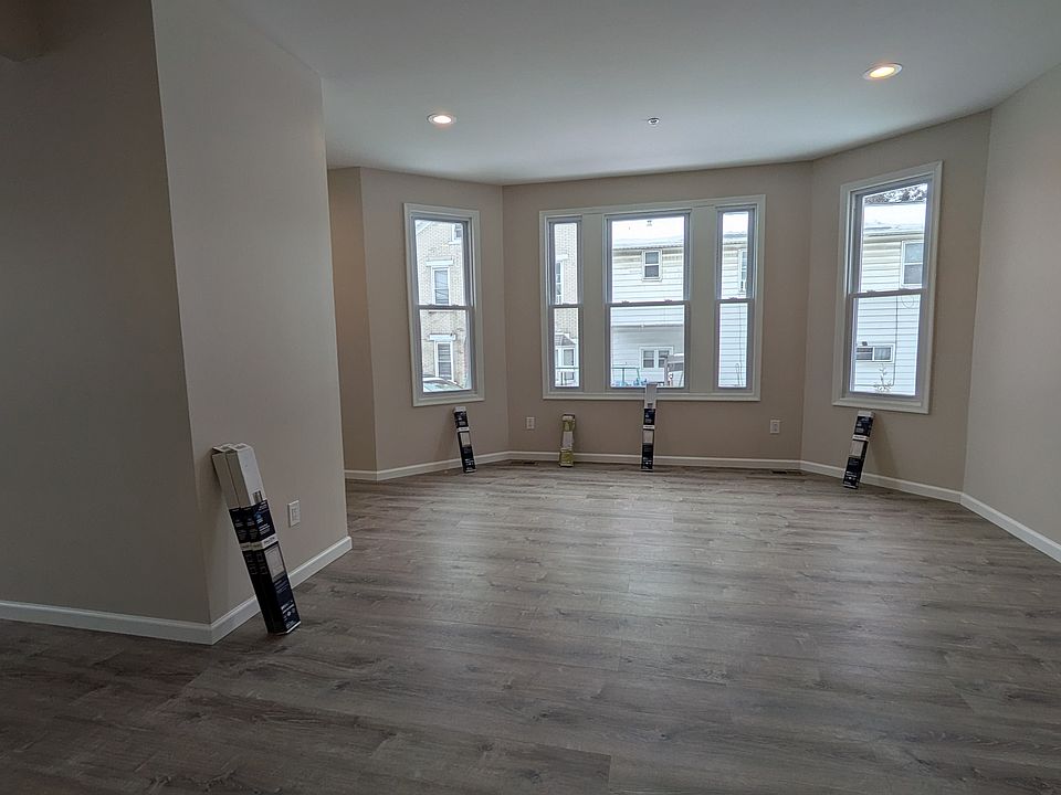 spacious and bright living room and dining room off of the front entrance