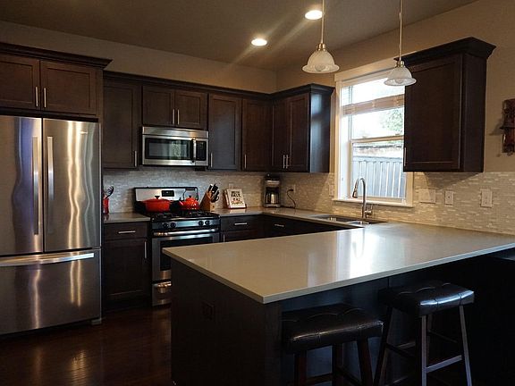 spacious kitchen with quartz counter tops