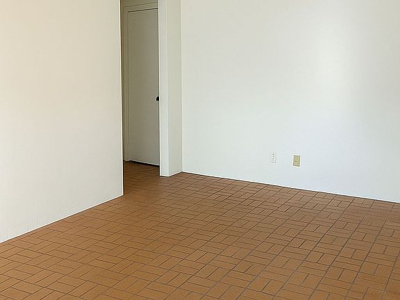 Other view of the main entrance/living room

Access to one of the bedrooms and bathroom