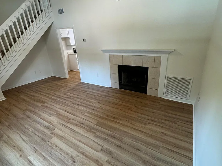 Living room and stairs to upstairs bed and bath