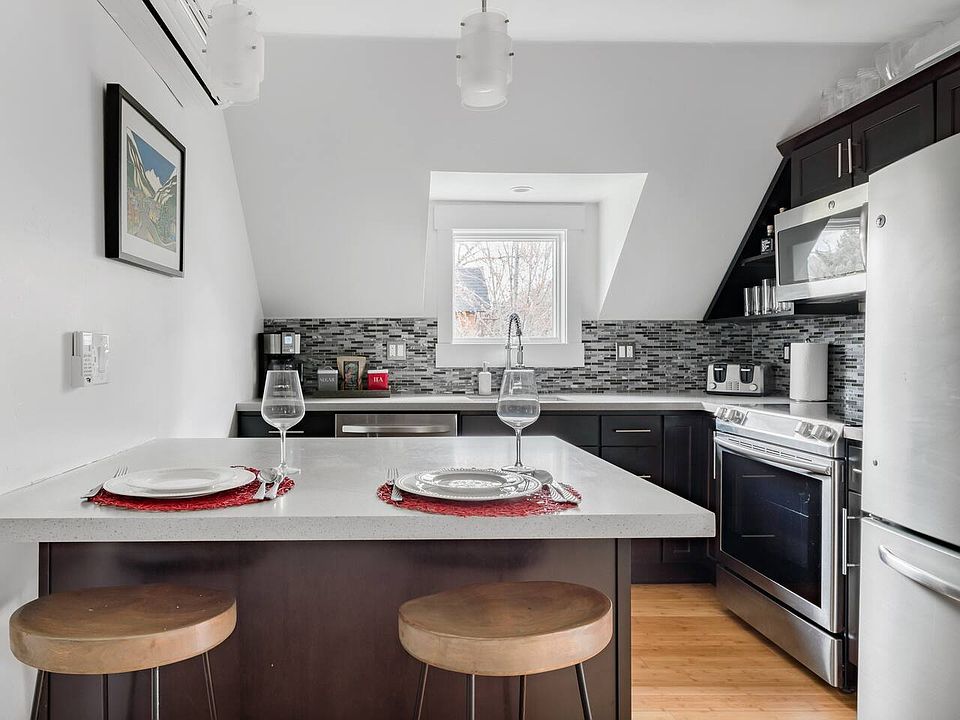 Modern & fully equipped kitchen, island dining for two.