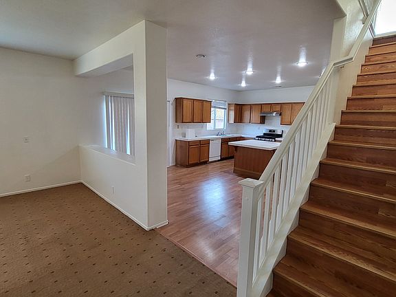 Home opens into dining area, stairway, kitchen, and living room.
