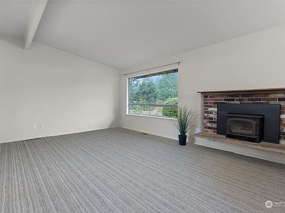 Enjoy vaulted ceilings, with cozy winter nights by the fireplace>