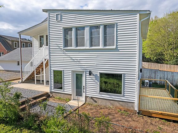 Apartment 100 entrance to living room and view of deck.