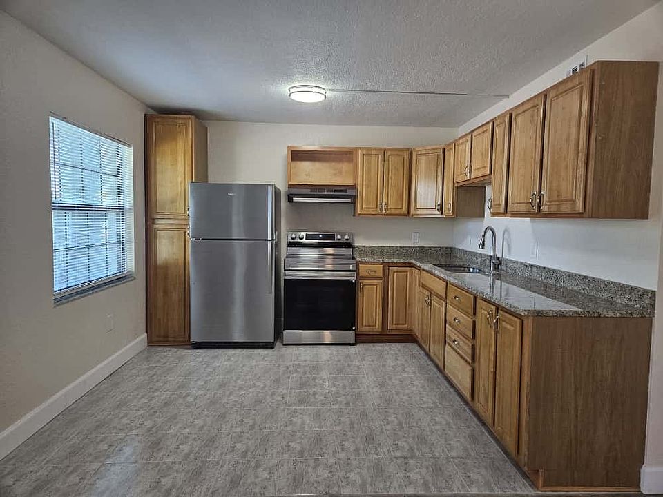 Updated Kitchen with Granite Countertops, New Appliances, Floor to Ceiling Pantry and plenty of space