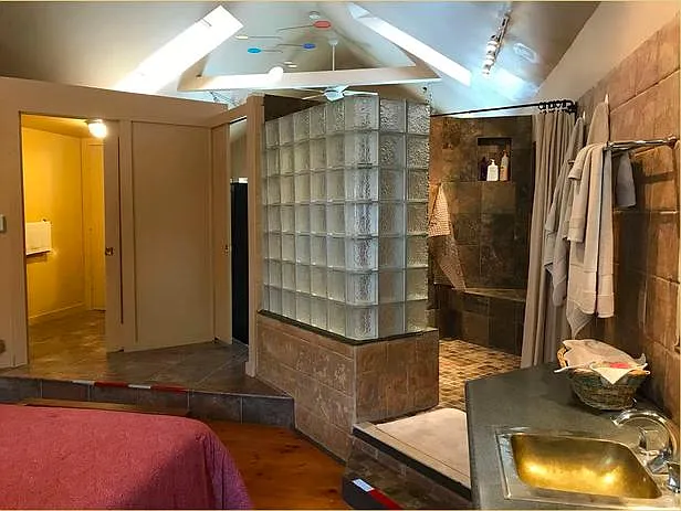 Master bedroom, en-suite bathroom, walk-in shower, vaulted ceilings.