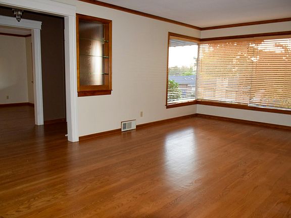 Family/Living Room with wood burning fire place.