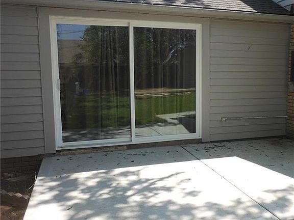 New concrete patio and sliding glass doors