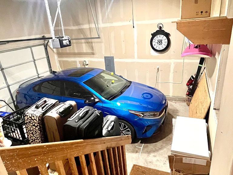 Spacious 2-Car Garage: Convenient single-door design with plenty of room for vehicles. Includes an additional built-in storage room_perfect for a workshop, hobbies, or extra household storage!