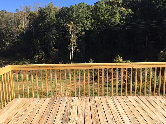 Large deck overlooking Hominy Creek