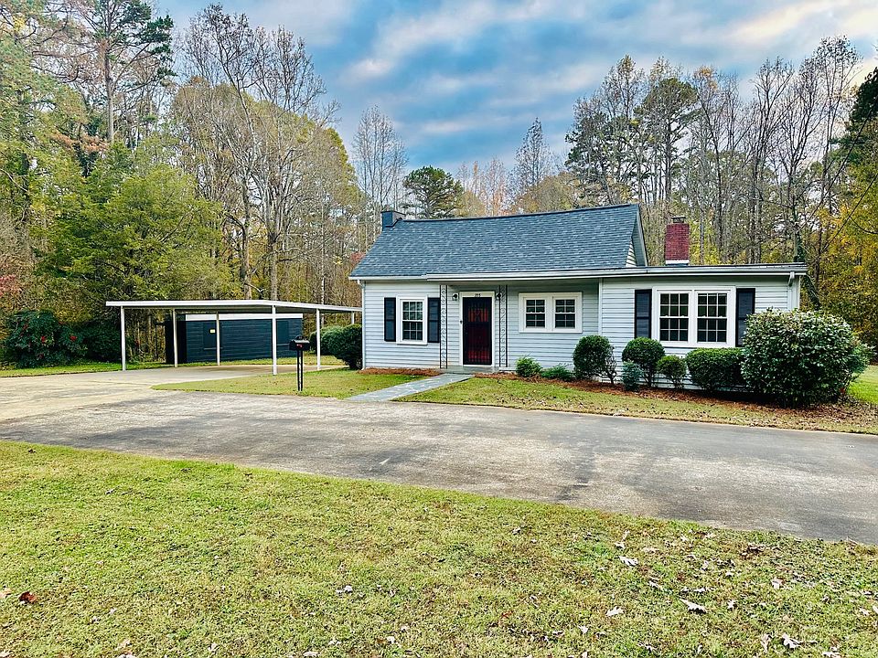 Over one acre of complete privacy and two car covered parking. Home also has storage building with work bench