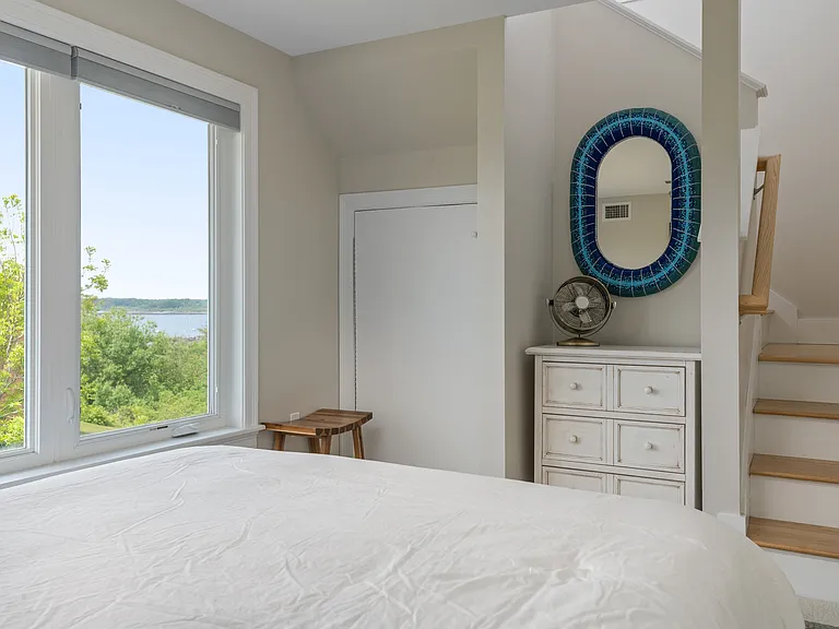 the third floor bedroom with a queen size bed