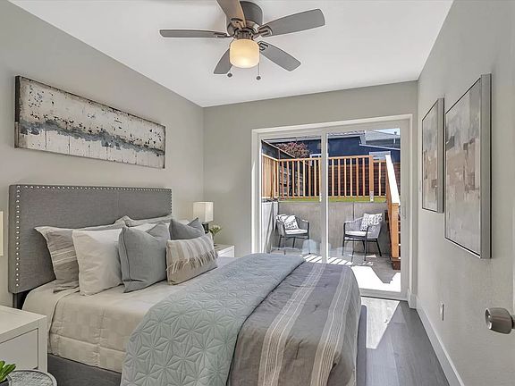 Second bedroom with access to the lush backyard.