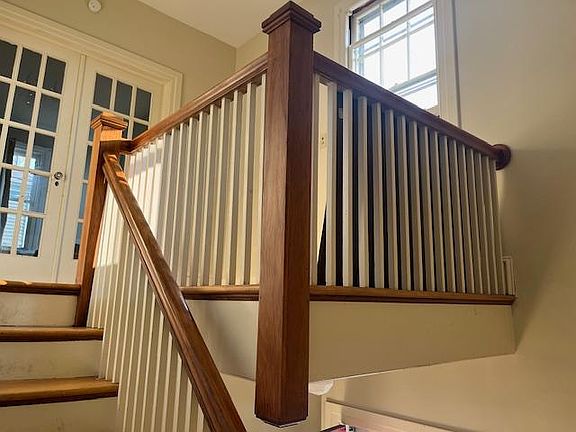 Private front entrance with turned staircase