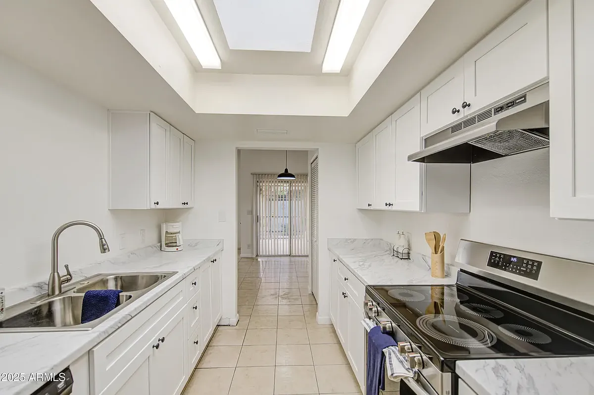 Kitchen leads to dining area. - 712 S Lebanon Ln