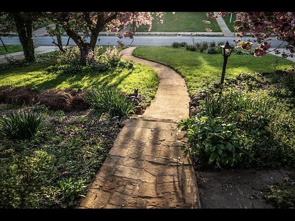 Sidewalk that leads to the shoppes at friendly