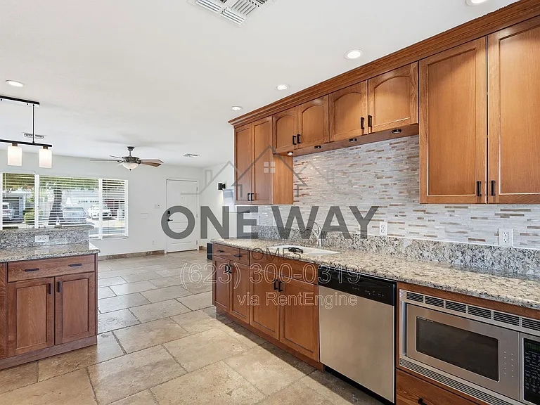 8702 E Sheridan St — Photo 10