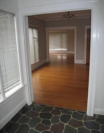 View from breakfast room through dining room to living room and front entry