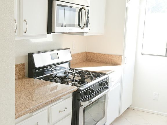 Light and bright kitchen with stainless steel appliances